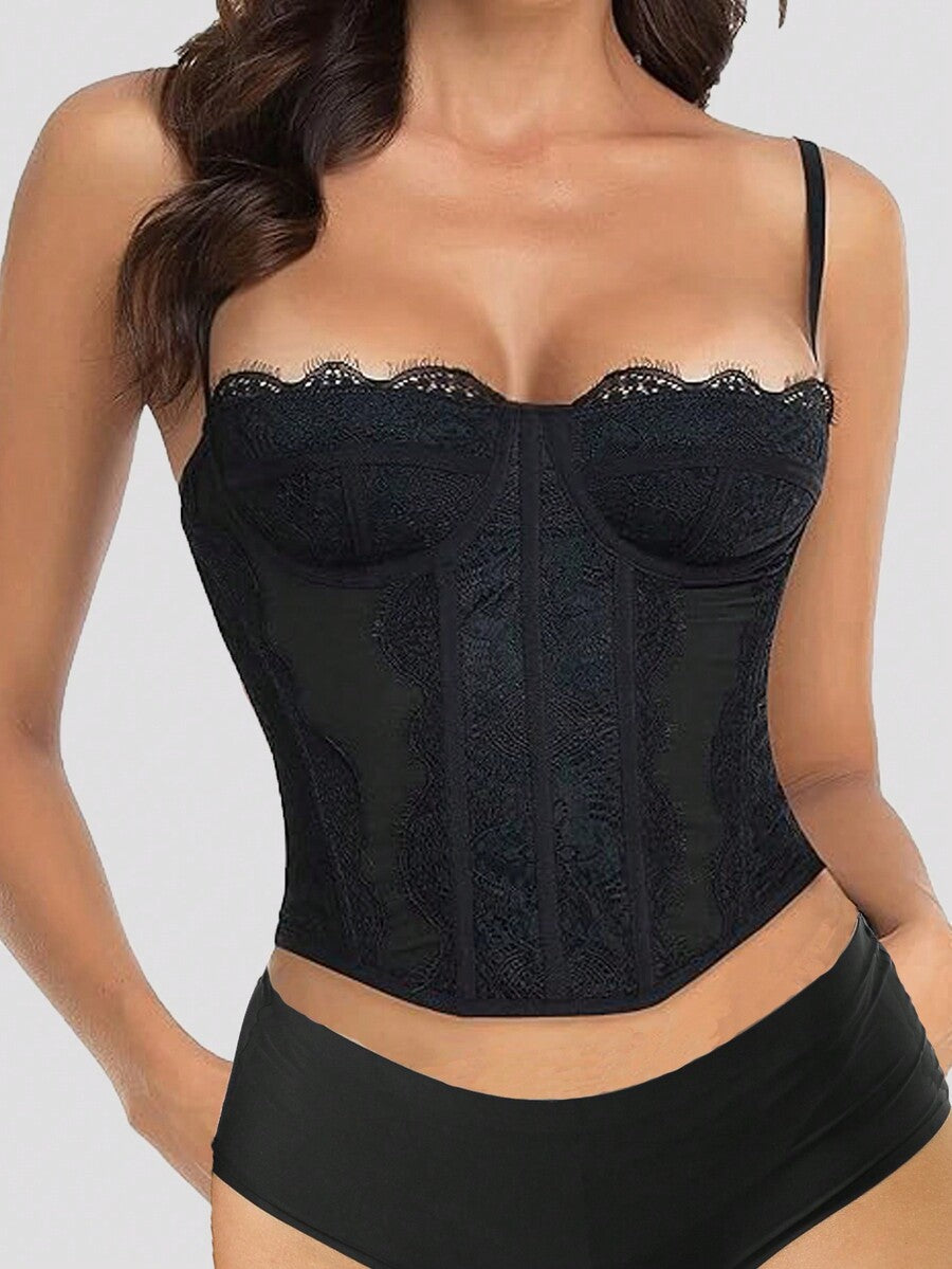 Black lace bustier corset top for women with asymmetrical contrast lace, lace-up detail, sleeveless crop cut, and light support.