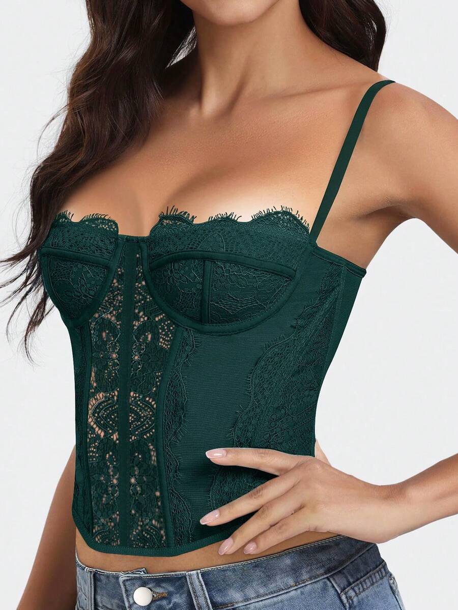 Black lace bustier corset top for women with asymmetrical contrast lace, lace-up detail, sleeveless crop cut, and light support.