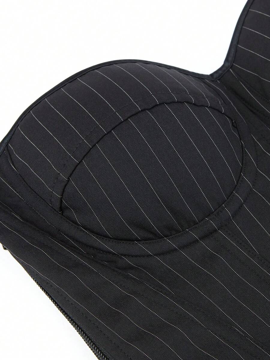 Black overbust corset top with strapless design, boned support, tie-back and zipper closure for women shapewear styling.