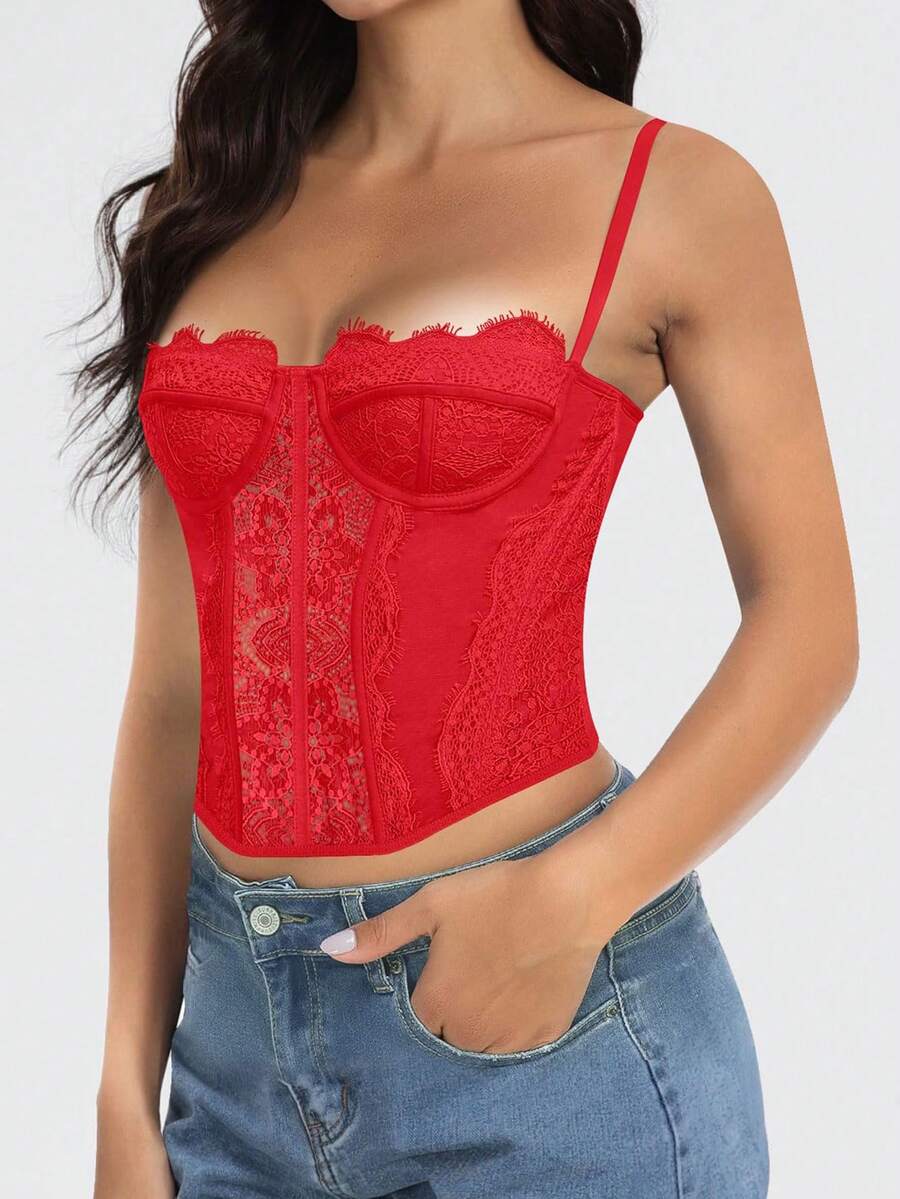Black lace bustier corset top for women with asymmetrical contrast lace, lace-up detail, sleeveless crop cut, and light support.
