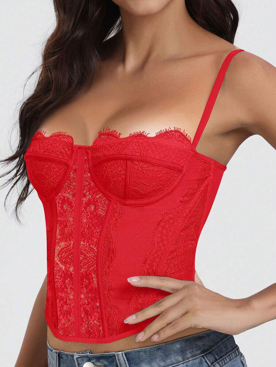 Black lace bustier corset top for women with asymmetrical contrast lace, lace-up detail, sleeveless crop cut, and light support.