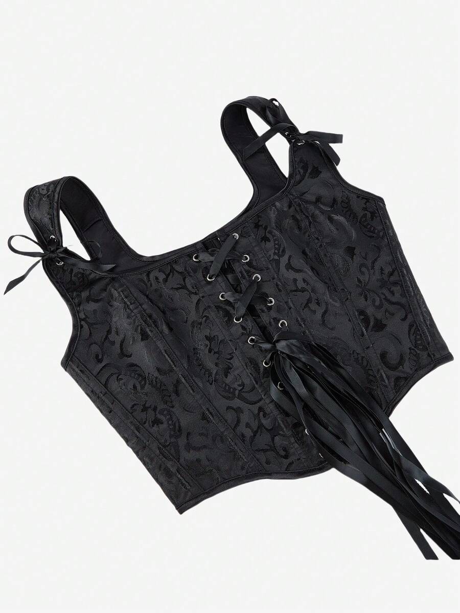 Women’s goth corset top in black with a lace-up back, sleeveless design, and structured bustier silhouette styled as outerwear.