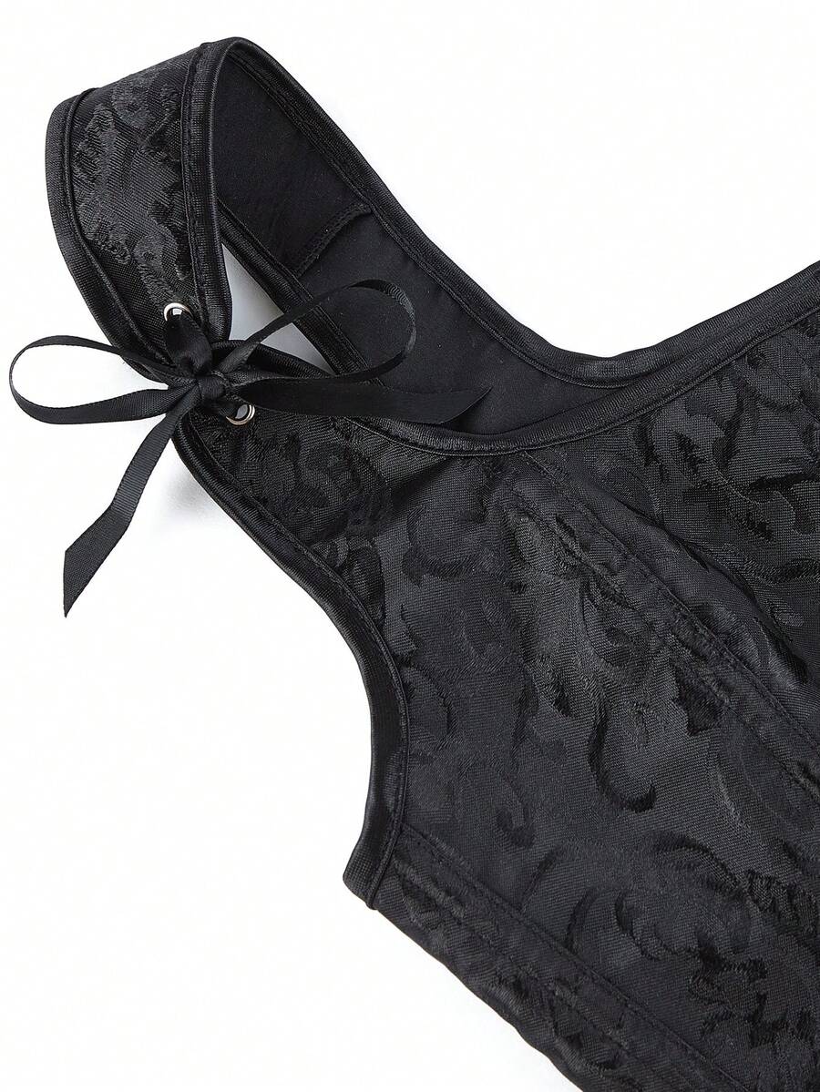 Women’s goth corset top in black with a lace-up back, sleeveless design, and structured bustier silhouette styled as outerwear.