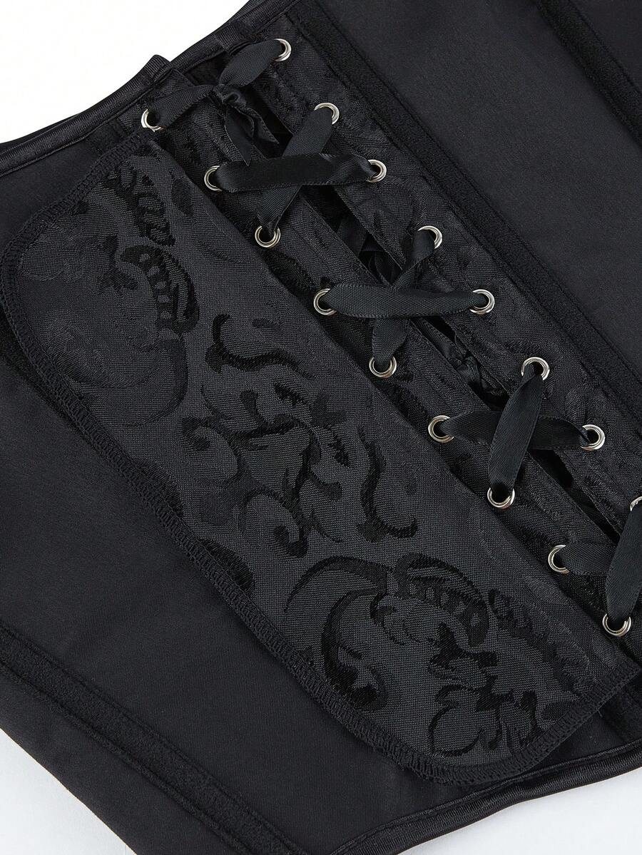 Women’s goth corset top in black with a lace-up back, sleeveless design, and structured bustier silhouette styled as outerwear.
