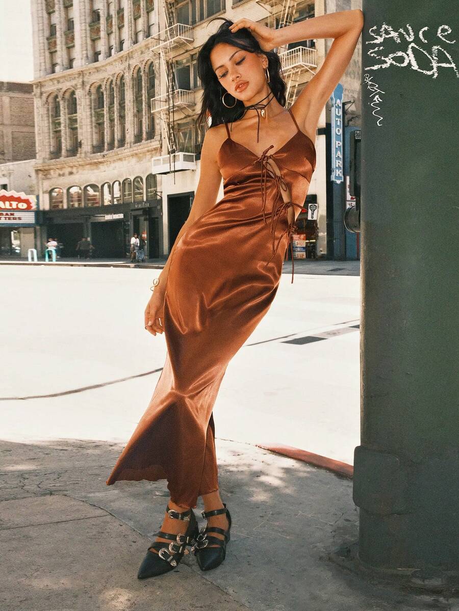 Women's coffee brown satin slip dress featuring spaghetti straps, a backless criss-cross knot design, high waist, and a side slit long hem.