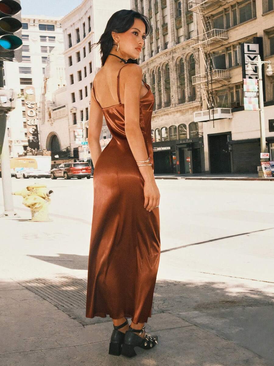 Women's coffee brown satin slip dress featuring spaghetti straps, a backless criss-cross knot design, high waist, and a side slit long hem.