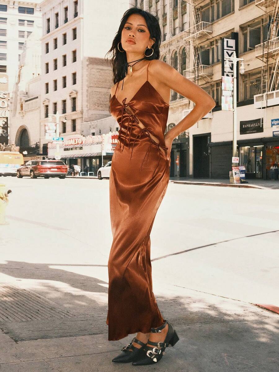Women's coffee brown satin slip dress featuring spaghetti straps, a backless criss-cross knot design, high waist, and a side slit long hem.