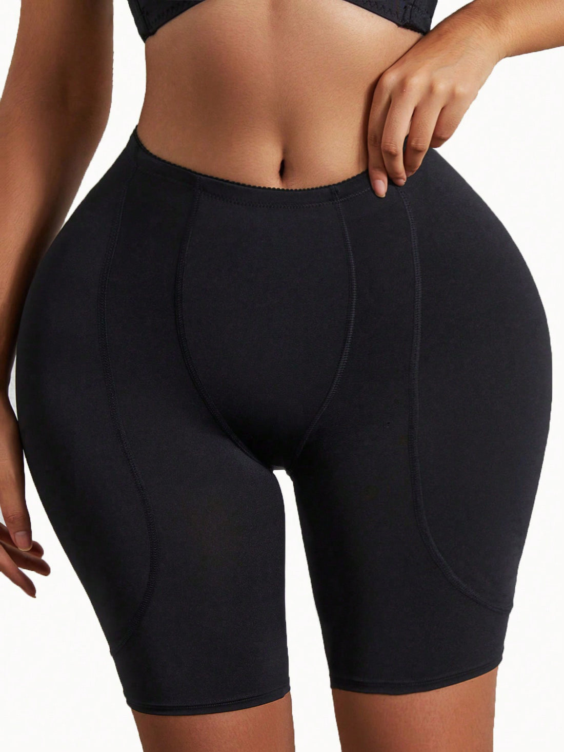 Black high waist padded butt lifting shapewear shorts for women featuring smooth knitted fabric and medium support.
