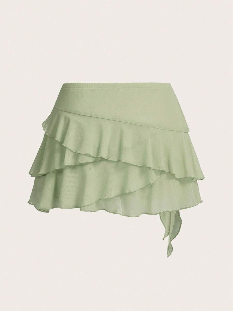 White tiered ruffle trim mini skirt for women with low waist, knot detail, mesh fabric, and casual Y2K boho design.