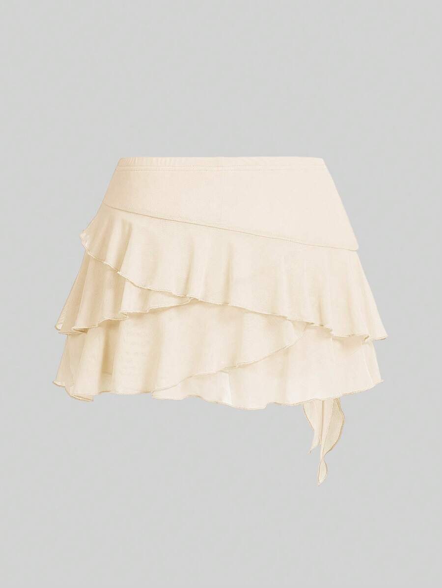 White tiered ruffle trim mini skirt for women with low waist, knot detail, mesh fabric, and casual Y2K boho design.