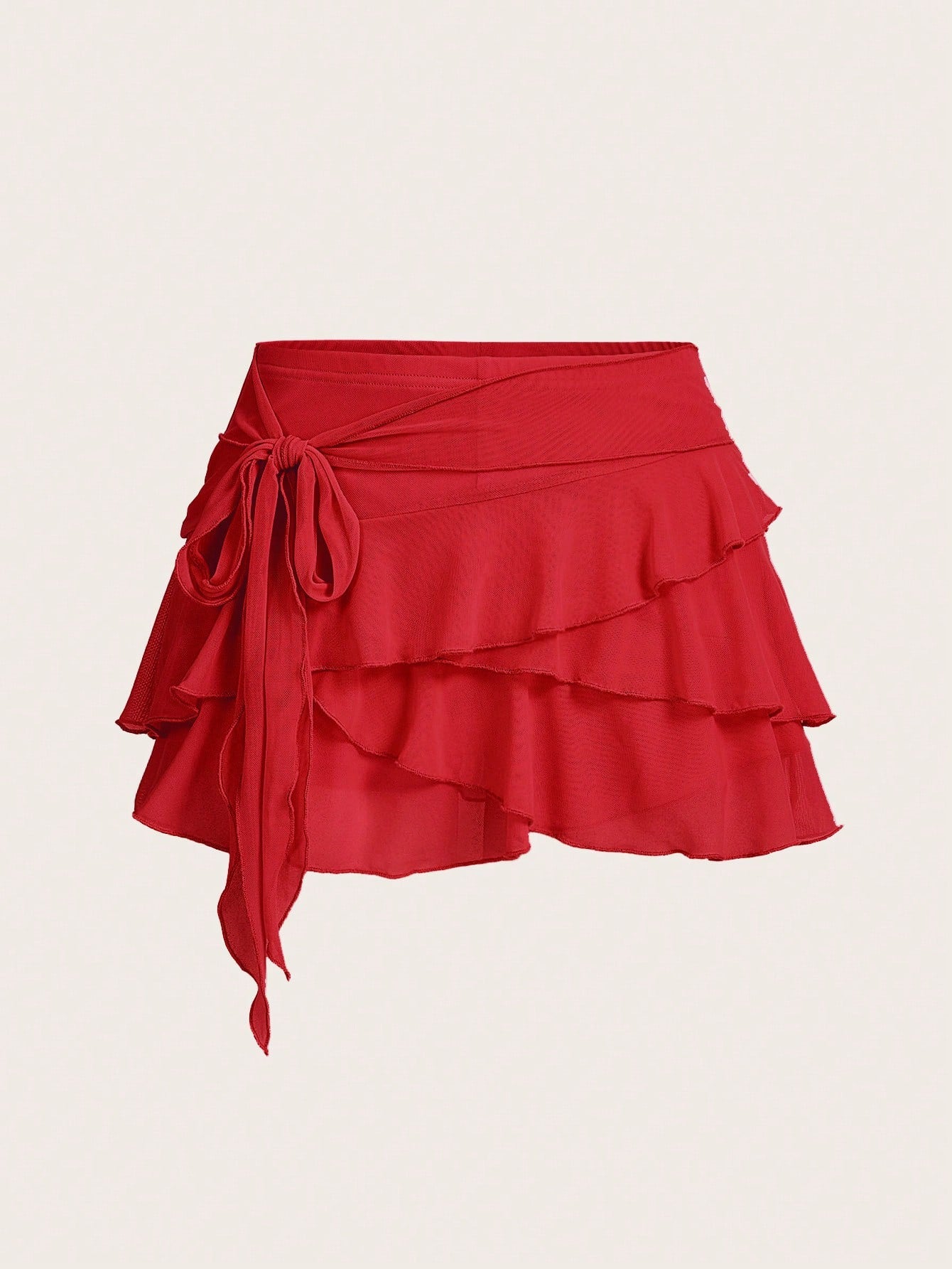 White tiered ruffle trim mini skirt for women with low waist, knot detail, mesh fabric, and casual Y2K boho design.