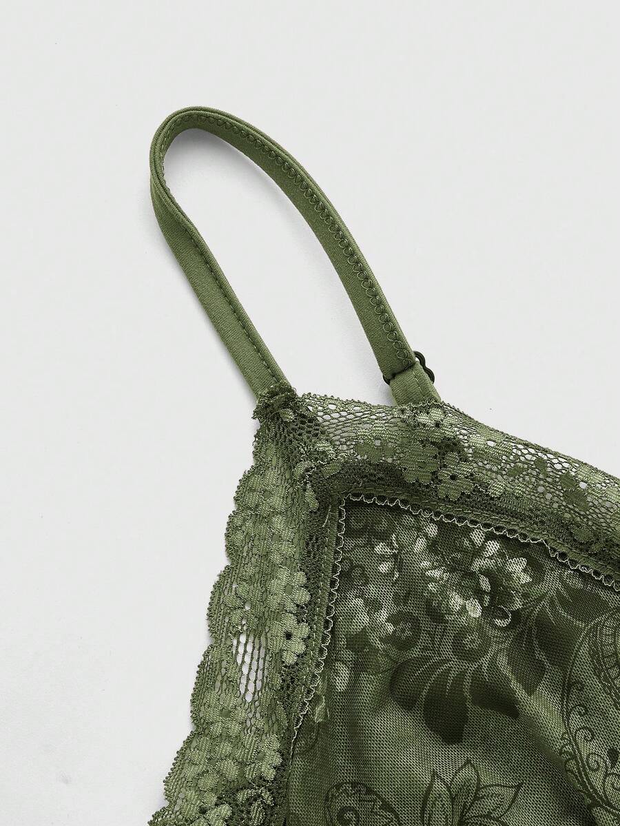 A women's sleeveless crop camisole featuring a vintage paisley print design with delicate lace trim along the neckline and thin spaghetti straps.