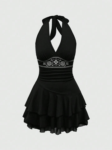 Women's sun totem embroidered sleeveless layered mini dress featuring a halter neck, backless tie back design, and slim fit high-waist A-line silhouette.