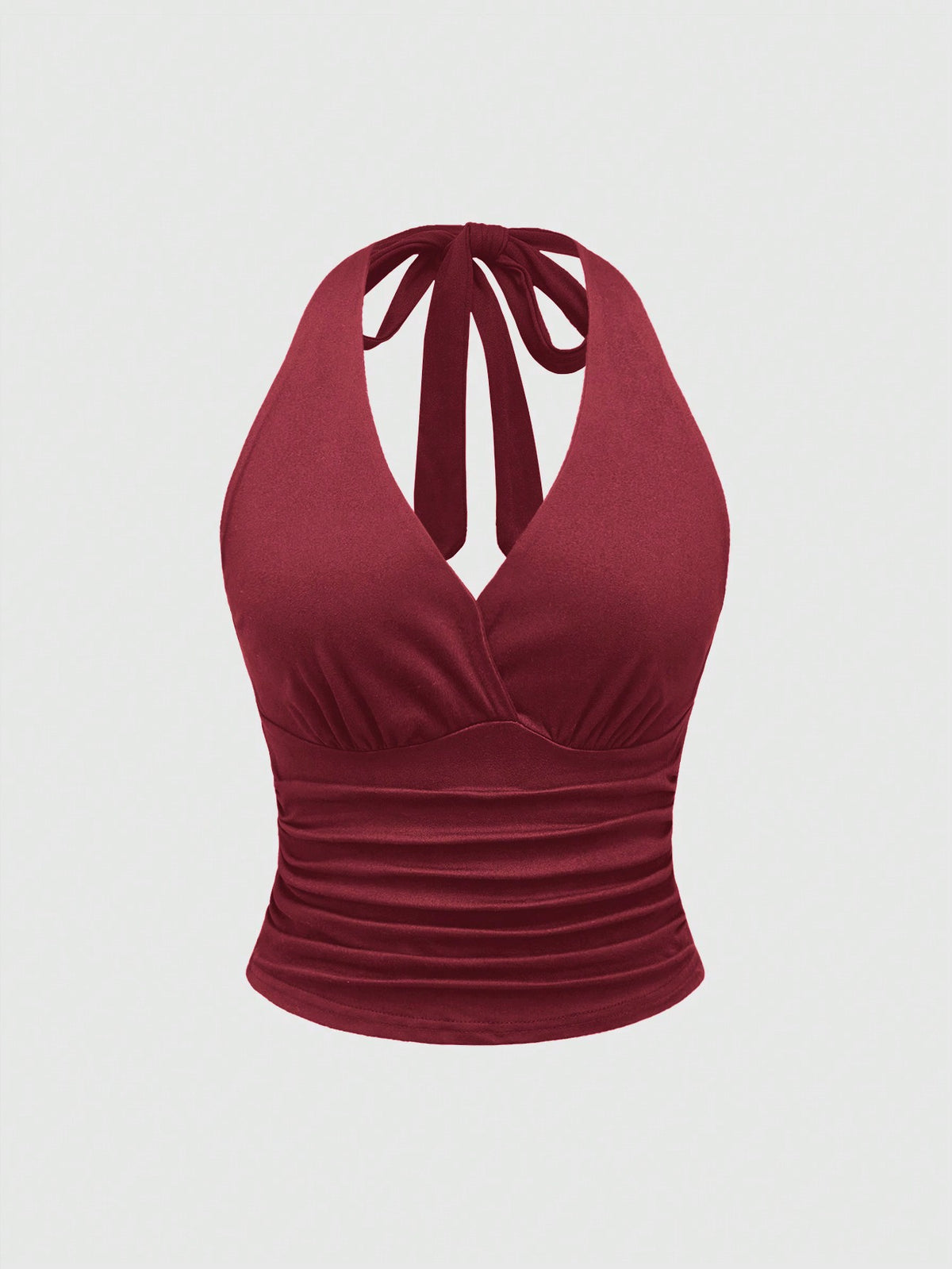 Women's halter crop tank top featuring a backless silhouette and ruched detailing in a slim fit design.
