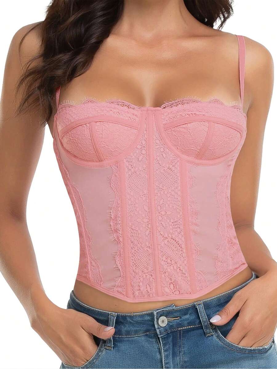 Black lace bustier corset top for women with asymmetrical contrast lace, lace-up detail, sleeveless crop cut, and light support.