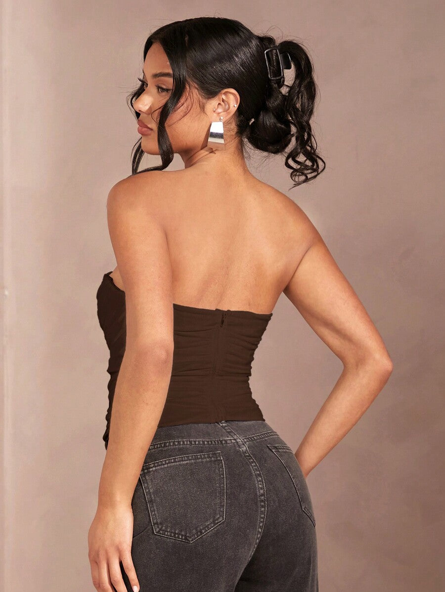 Black strapless corset crop top with asymmetrical lace-up ruched detailing and a slim fit for women.