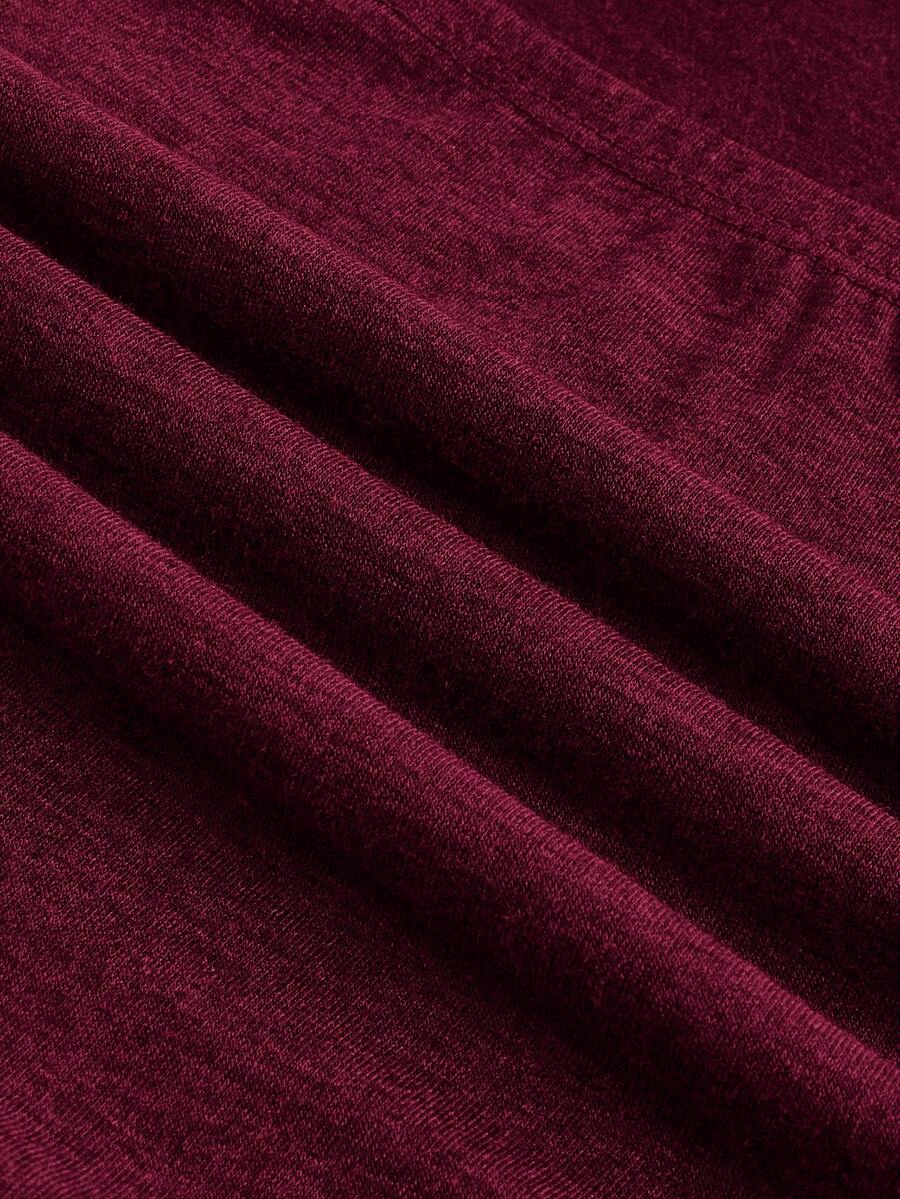 Women's strapless star print tube crop top featuring rhinestone details and ruched accents in burgundy knitted stretch fabric.