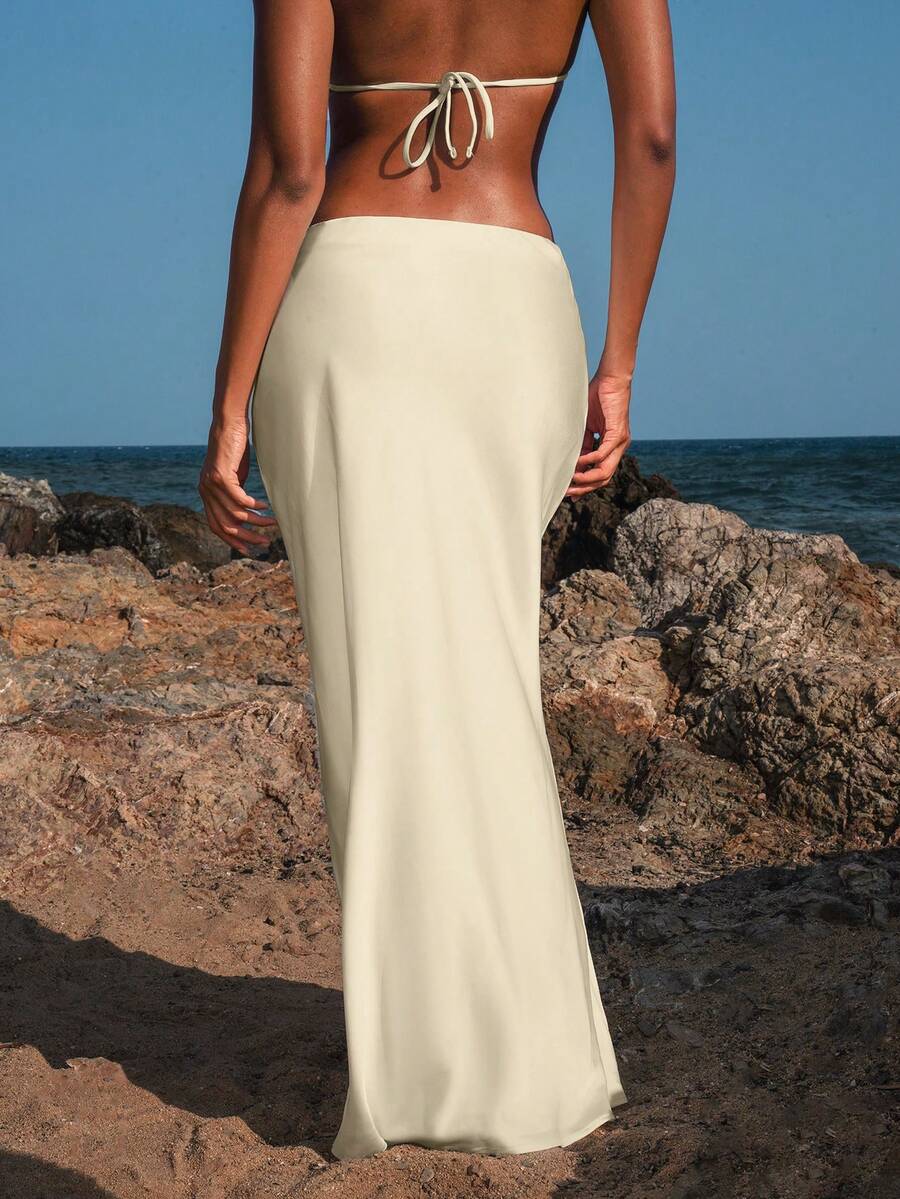 Women's black woven mermaid maxi skirt featuring a solid color design, mid waist, and 100% cotton fabric.