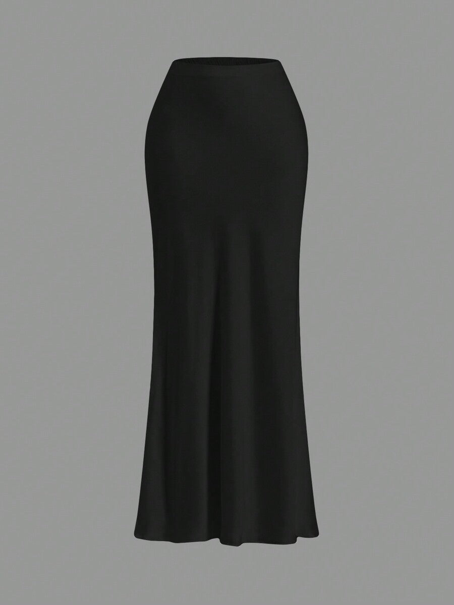 Women's black woven mermaid maxi skirt featuring a solid color design, mid waist, and 100% cotton fabric.