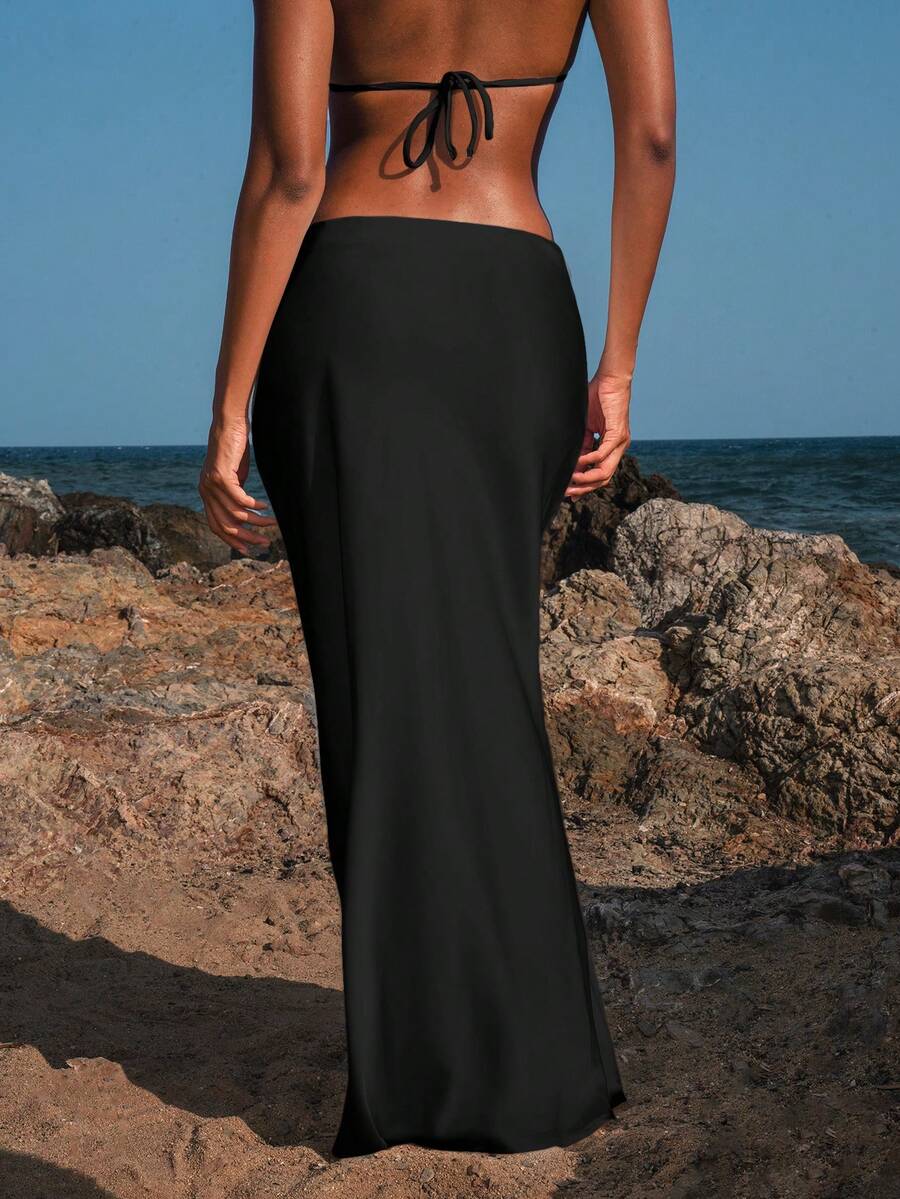Women's black woven mermaid maxi skirt featuring a solid color design, mid waist, and 100% cotton fabric.