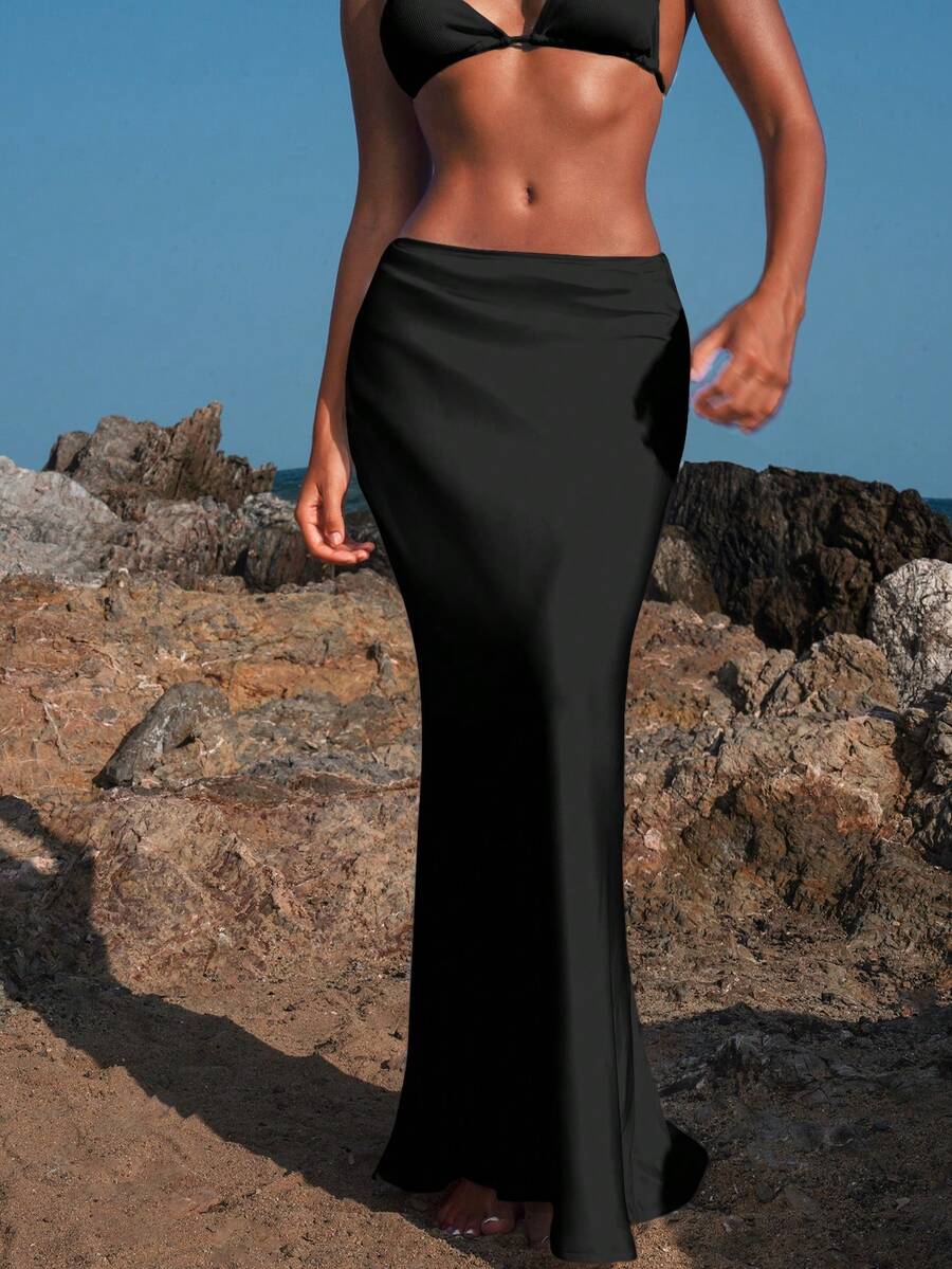 Women's black woven mermaid maxi skirt featuring a solid color design, mid waist, and 100% cotton fabric.