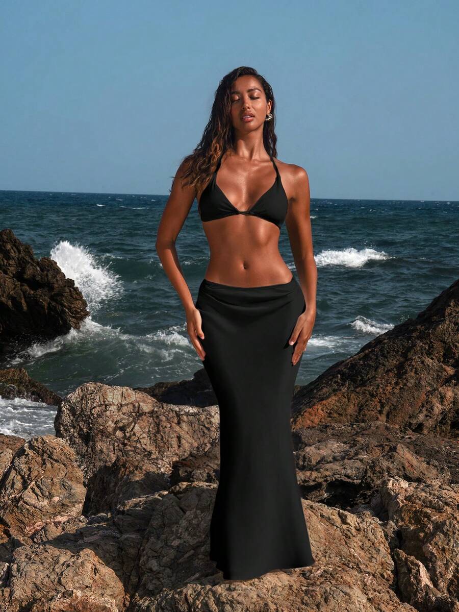 Women's black woven mermaid maxi skirt featuring a solid color design, mid waist, and 100% cotton fabric.