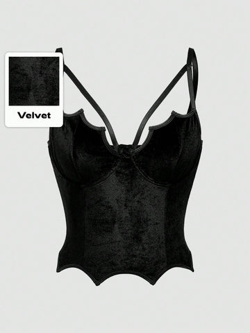 A women's black velvet crop camisole top featuring criss-cross shoulder straps, asymmetrical cut-out details, and a sleeveless vest neckline.