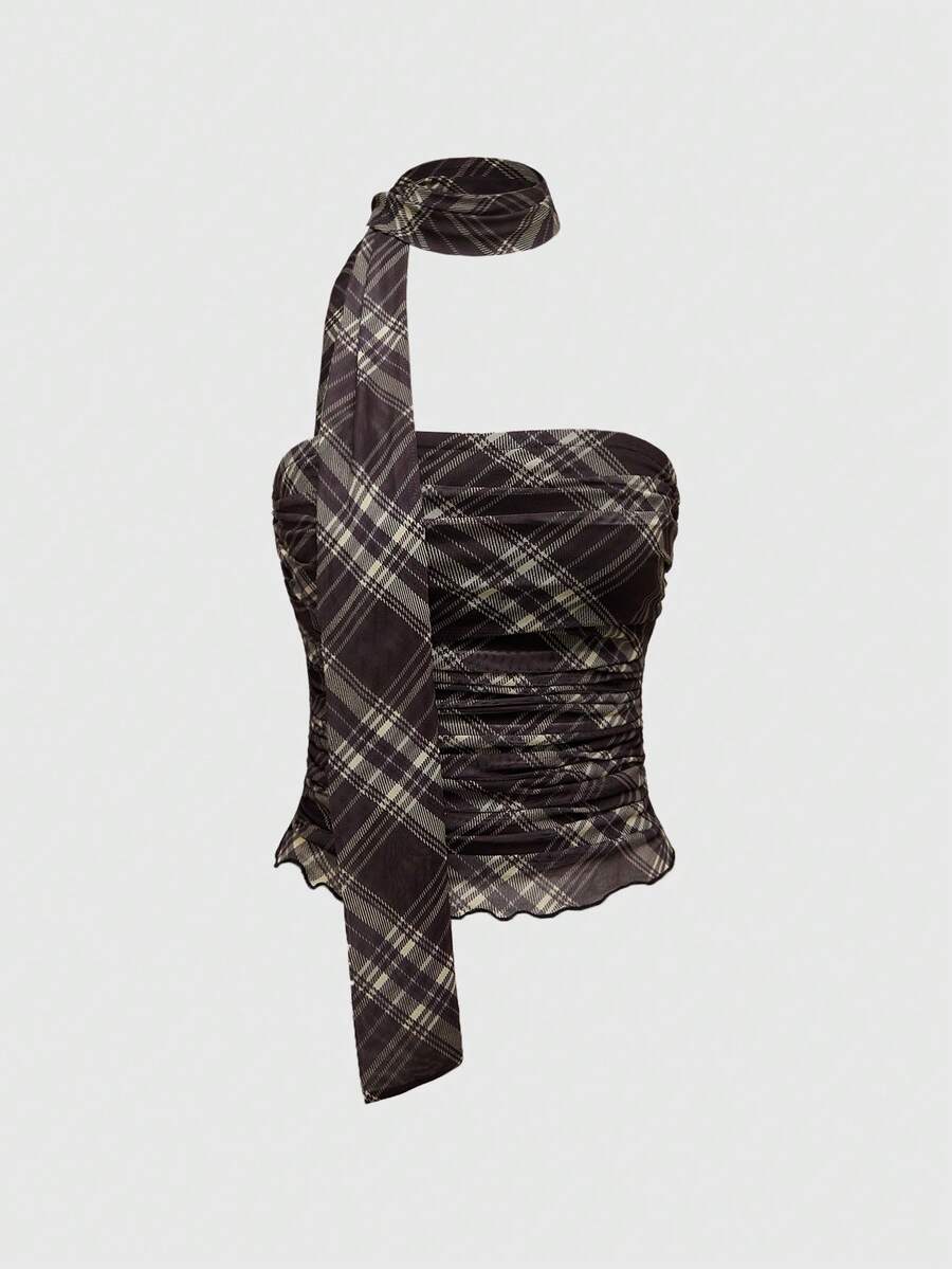 Women's black polka dot strapless tube top made of ruched mesh fabric featuring an asymmetrical hem and matching scarf.