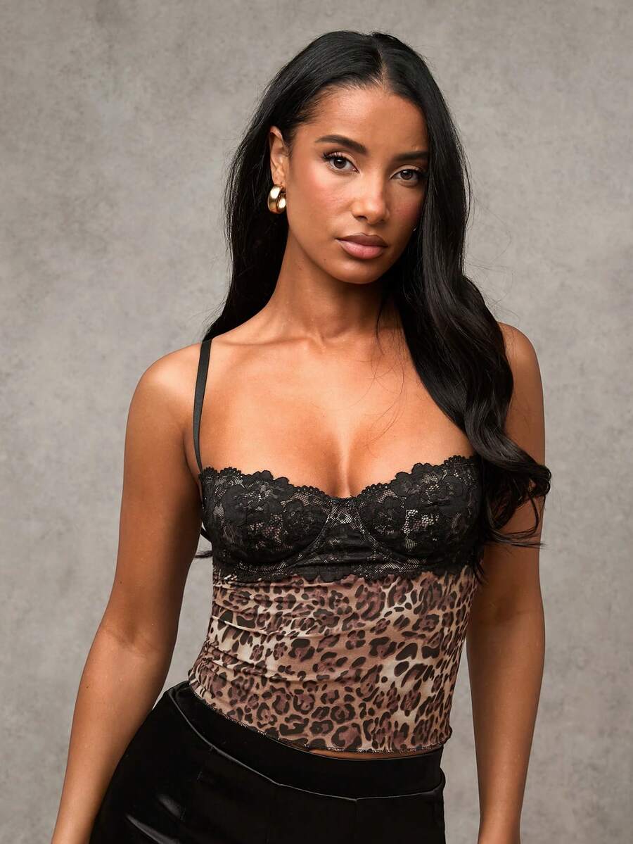 Women's black contrast lace camisole with spaghetti straps, cup detail, semi-sheer finish, and slim fit for going out or date night.