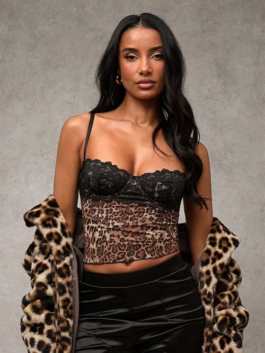Women's black contrast lace camisole with spaghetti straps, cup detail, semi-sheer finish, and slim fit for going out or date night.