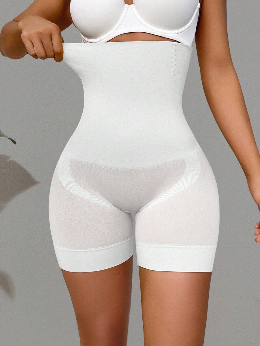 Apricot high stretch super high waist long shapewear shorts with textured pattern and semi-sheer fabric for women.