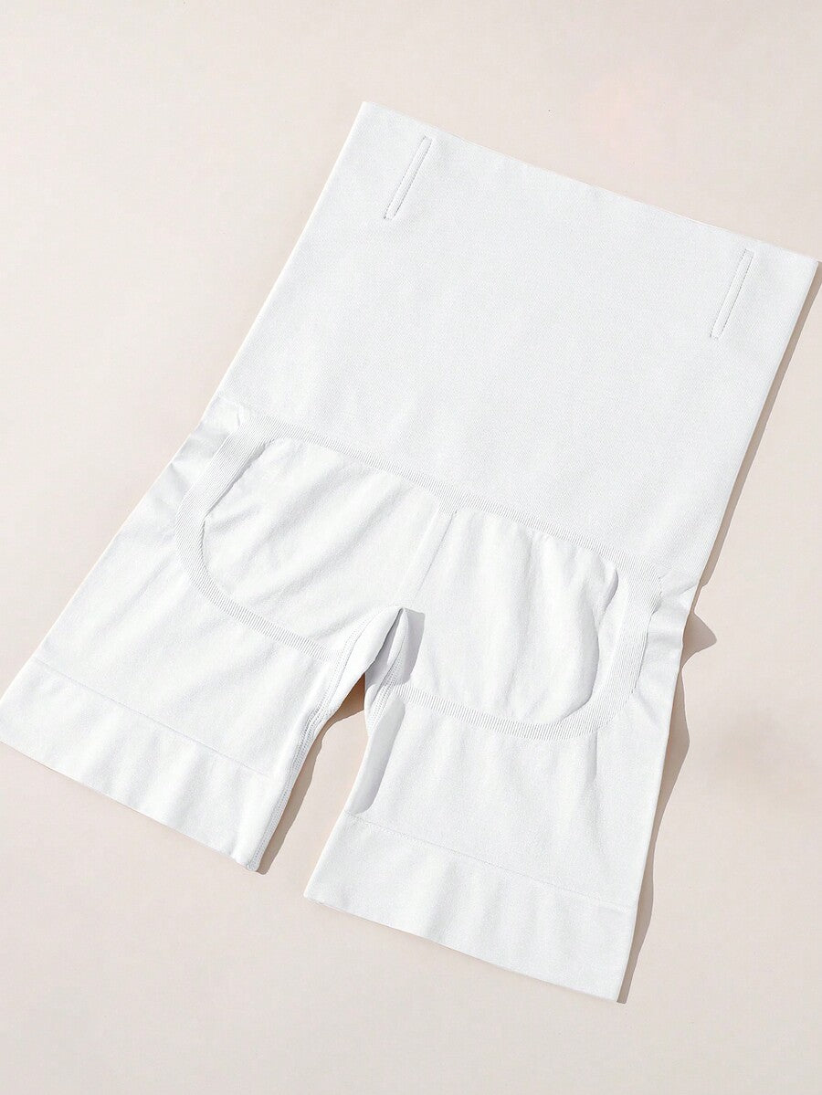 Apricot high stretch super high waist long shapewear shorts with textured pattern and semi-sheer fabric for women.
