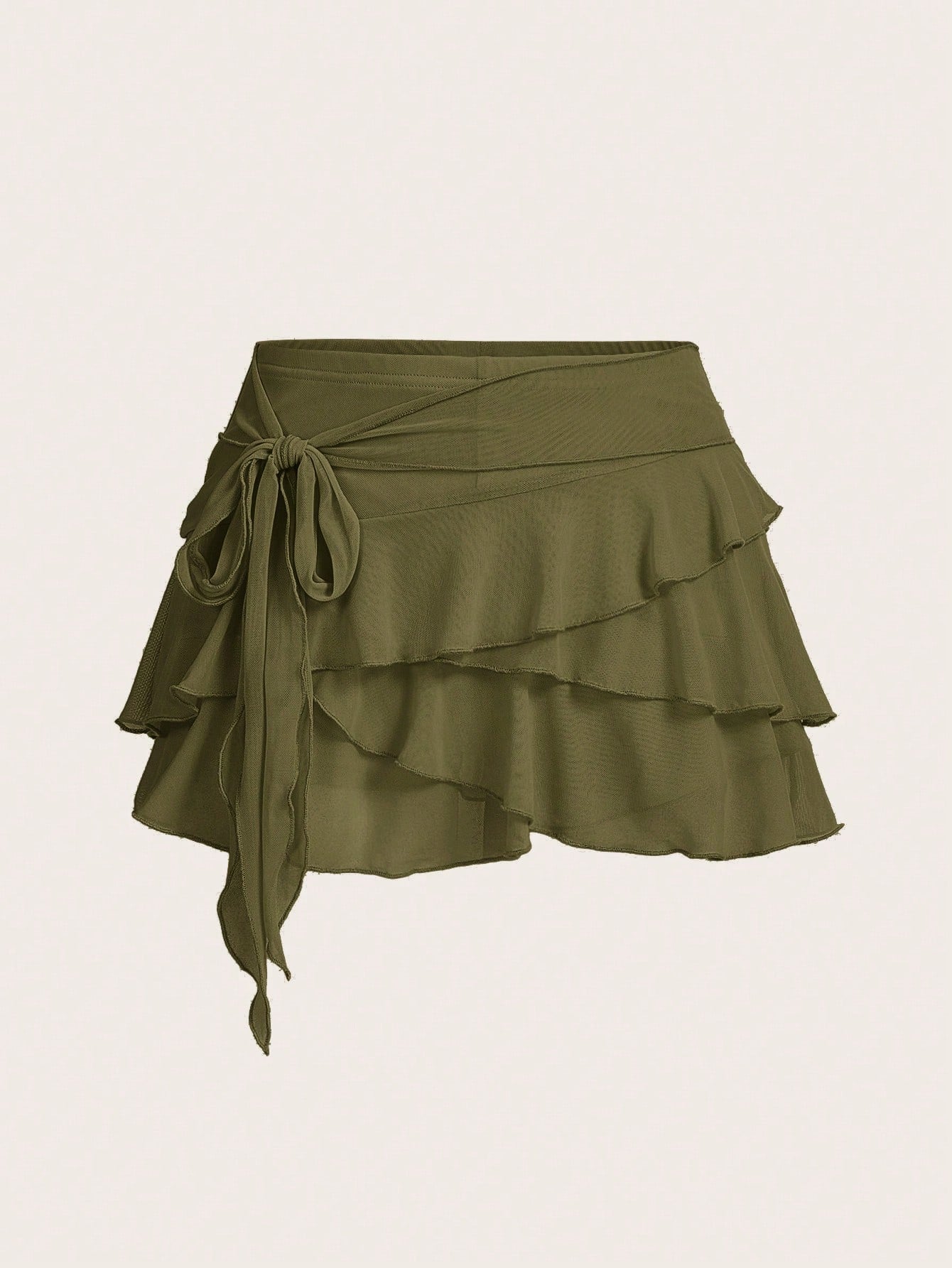 White tiered ruffle trim mini skirt for women with low waist, knot detail, mesh fabric, and casual Y2K boho design.