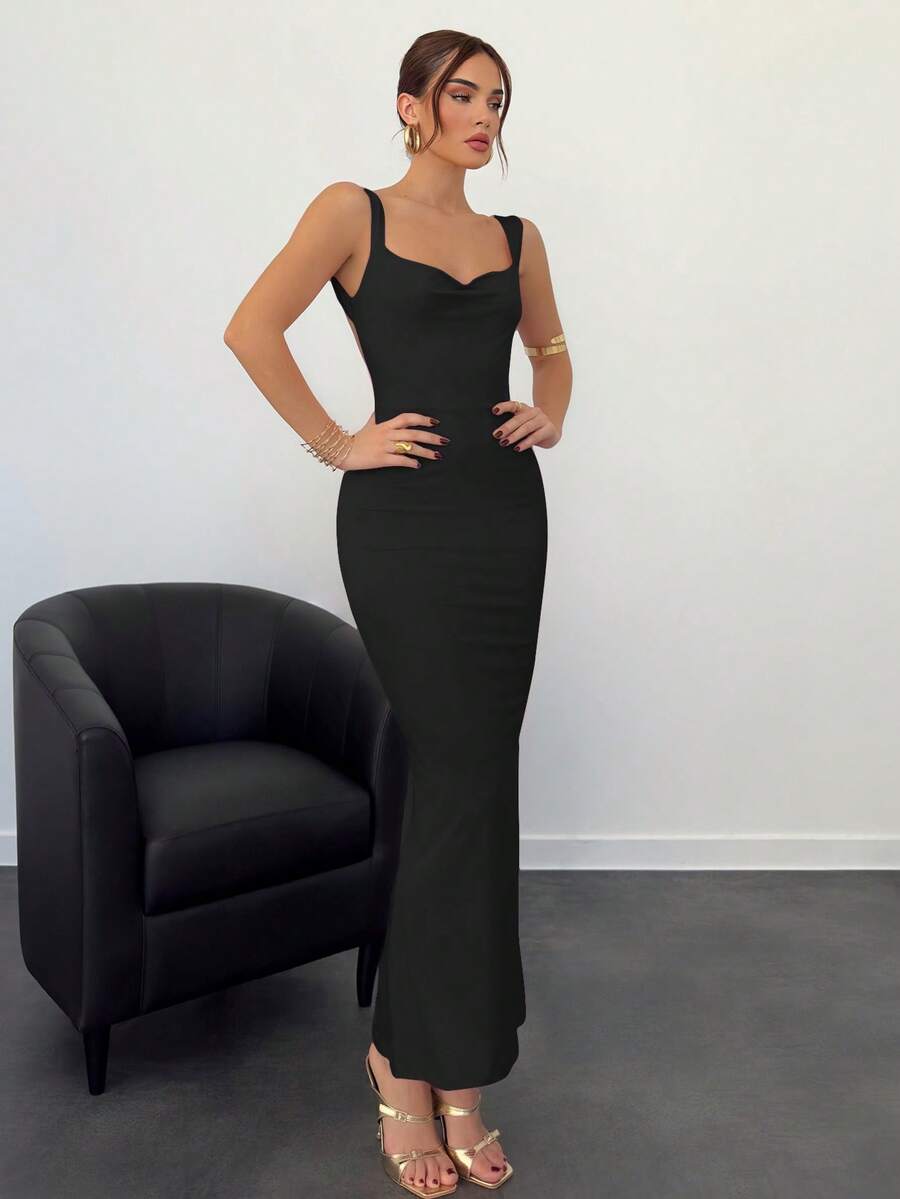 Beige sleeveless backless cami maxi dress for women featuring bow decor, split hem, and slim fit knitted fabric.
