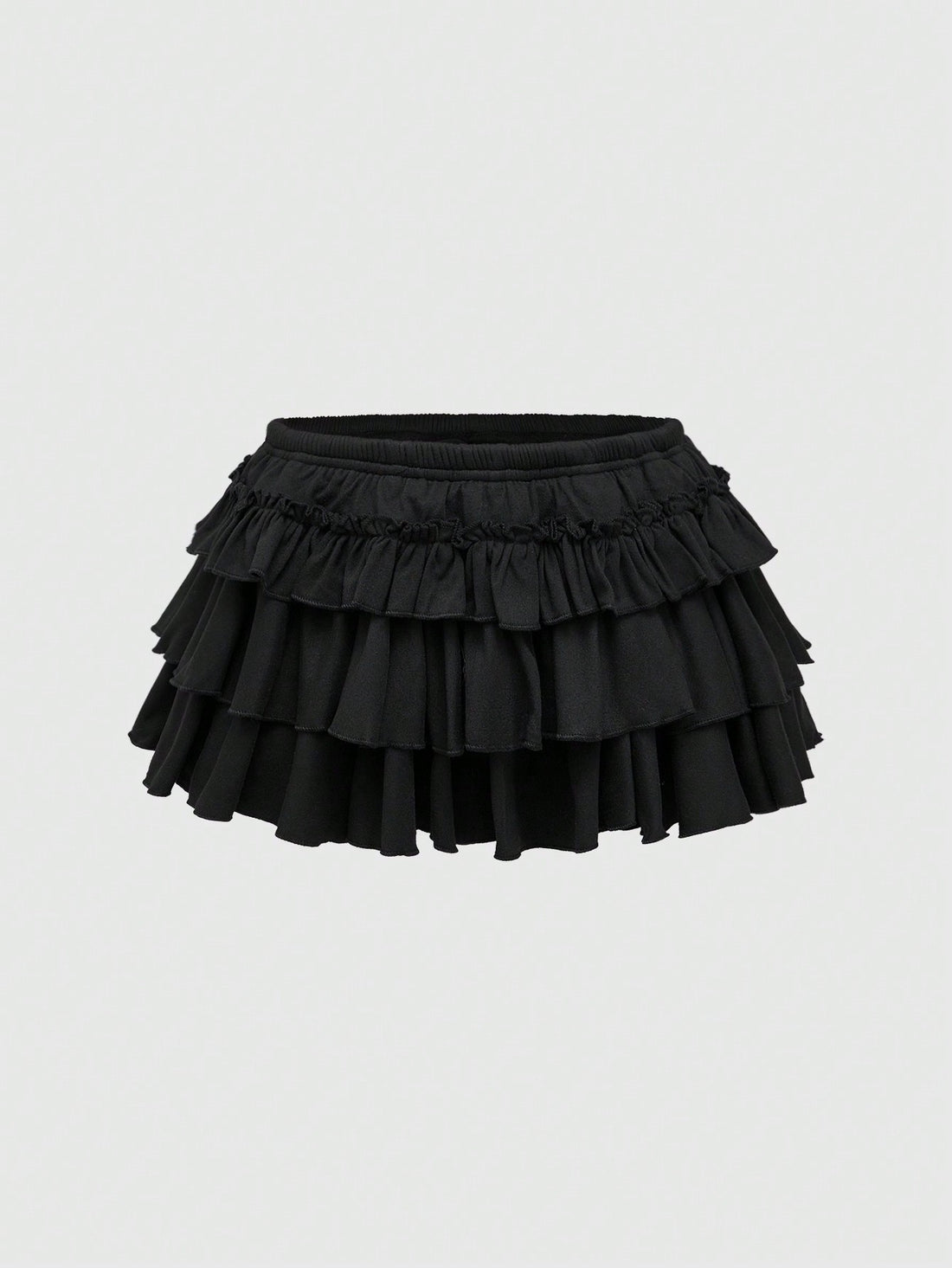 Black Y2K ultra low waist tiered ruffle mini skirt made of stretch knitted fabric for women.