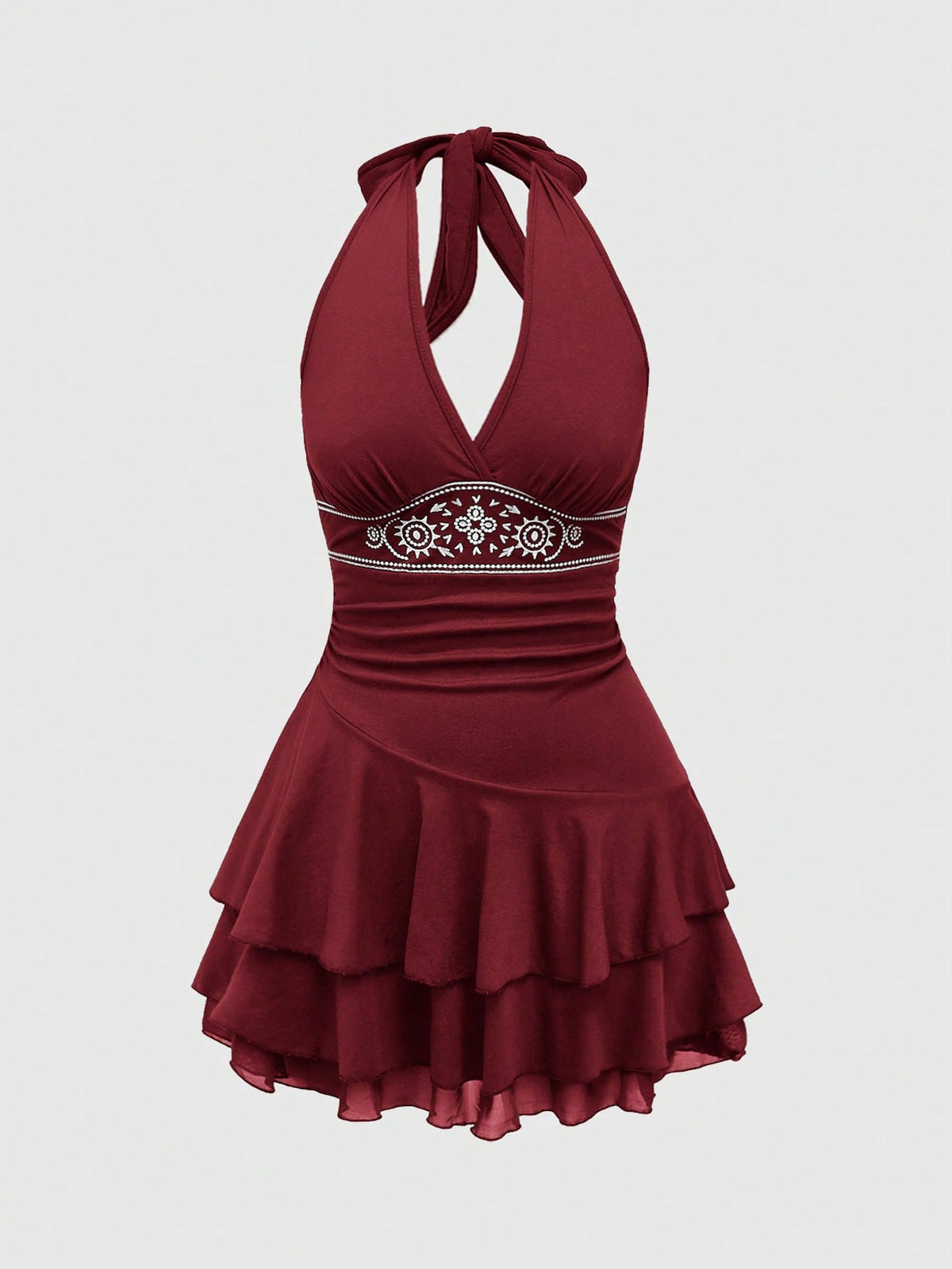 Women's sun totem embroidered sleeveless layered mini dress featuring a halter neck, backless tie back design, and slim fit high-waist A-line silhouette.