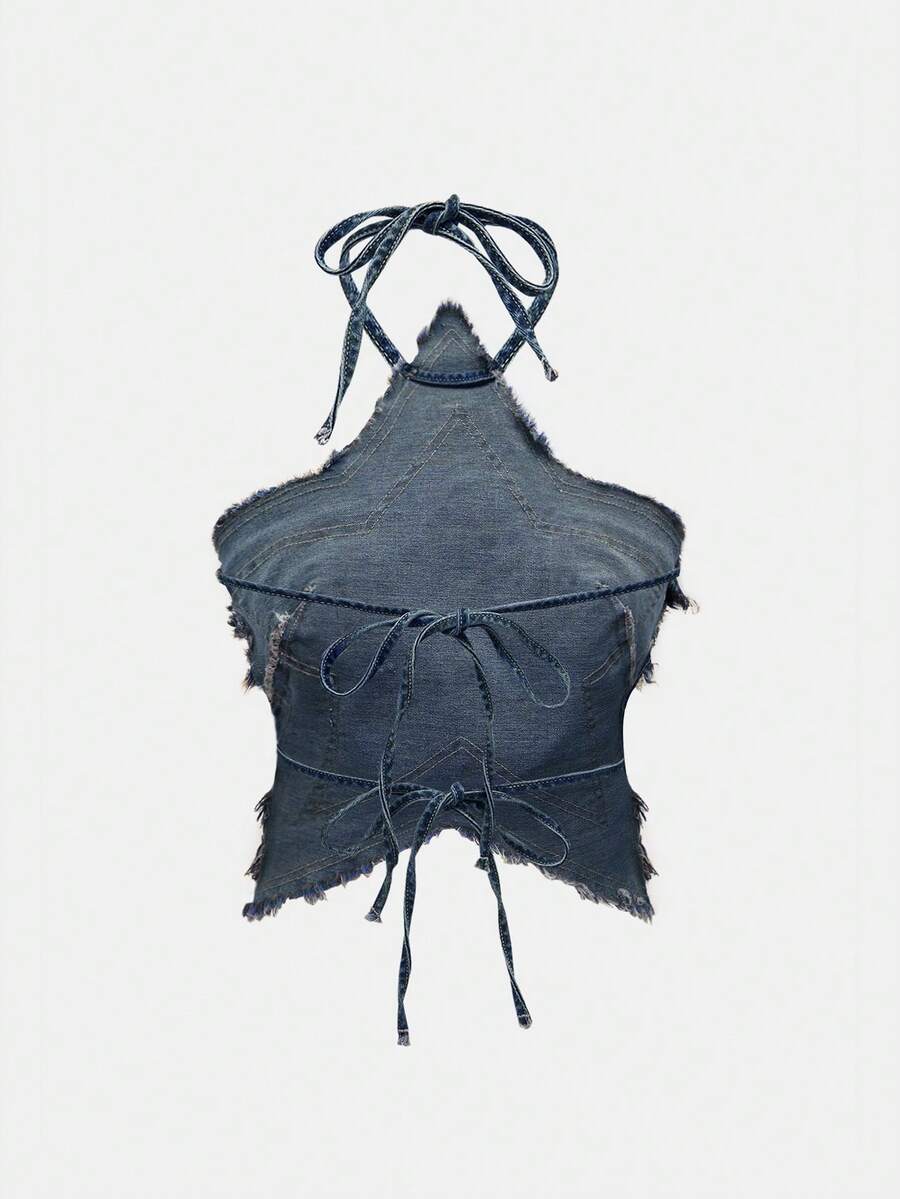 Blue denim halter tank top for women featuring distressed star patch detail, asymmetrical crop hem, and backless tie-back design.