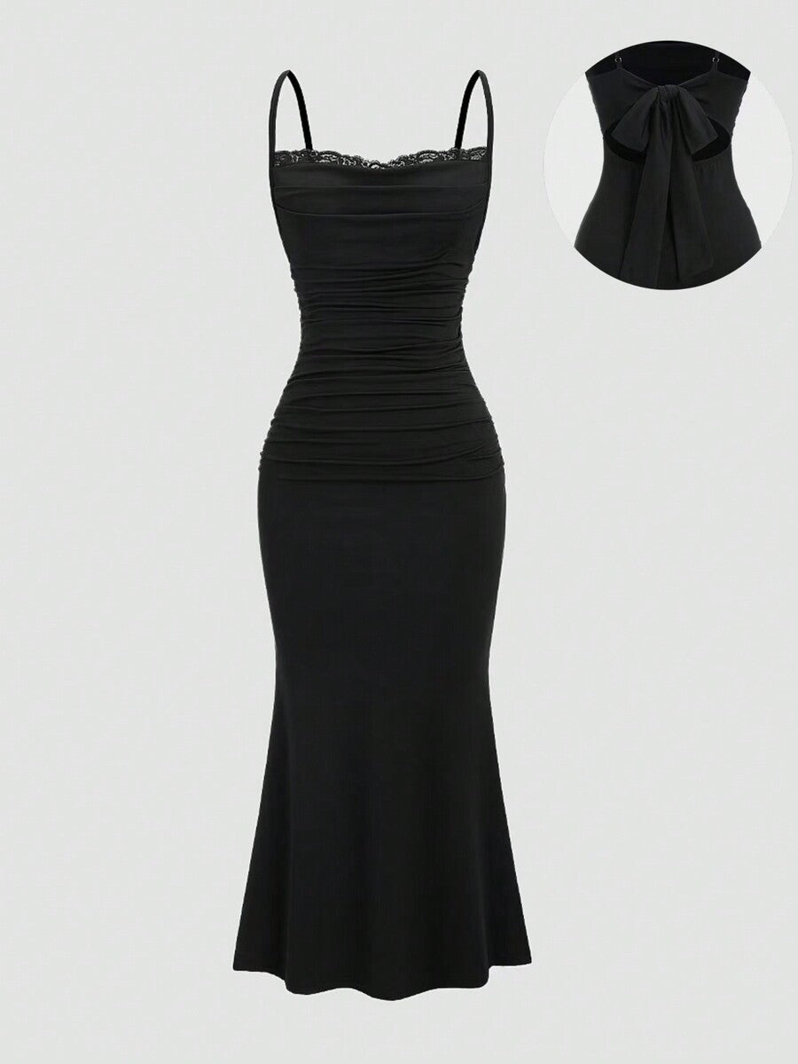 Women's black maxi evening dress featuring spaghetti straps, contrast lace trim, ruched backless design, and a slim fit mermaid hem.