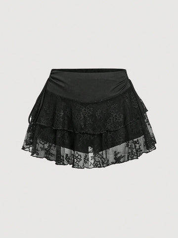 A woman wearing a black lace tiered ruffle mini skirt skort featuring a mid-waist design and layered hemline.