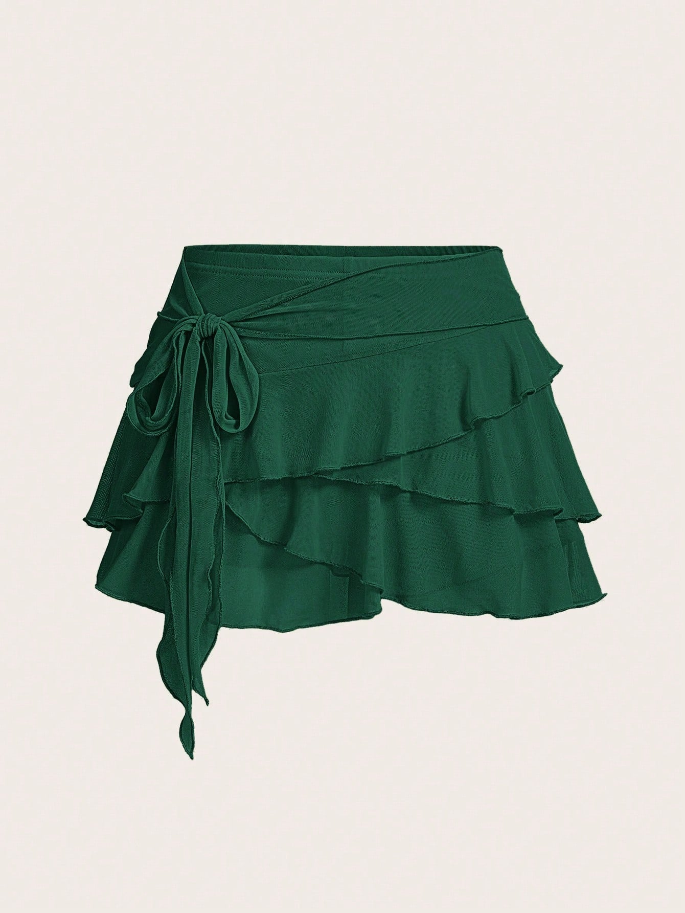 White tiered ruffle trim mini skirt for women with low waist, knot detail, mesh fabric, and casual Y2K boho design.
