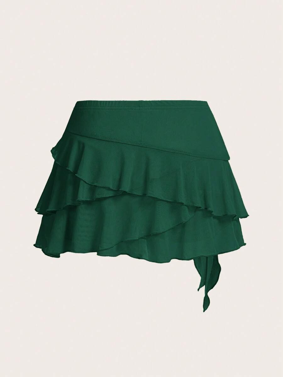 White tiered ruffle trim mini skirt for women with low waist, knot detail, mesh fabric, and casual Y2K boho design.