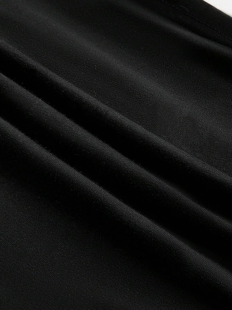 Black halter crop tank top featuring lace-up front details, ruched texture, eye appliques, and matching detached arm sleeves.