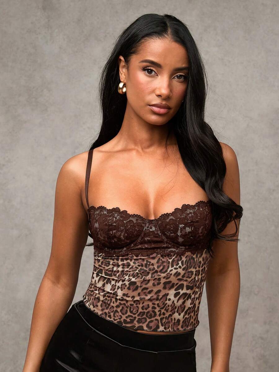 Women's black contrast lace camisole with spaghetti straps, cup detail, semi-sheer finish, and slim fit for going out or date night.
