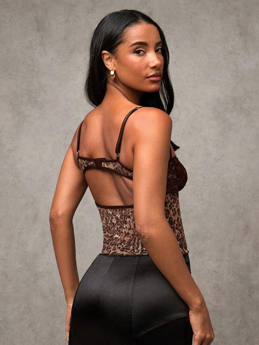 Women's black contrast lace camisole with spaghetti straps, cup detail, semi-sheer finish, and slim fit for going out or date night.