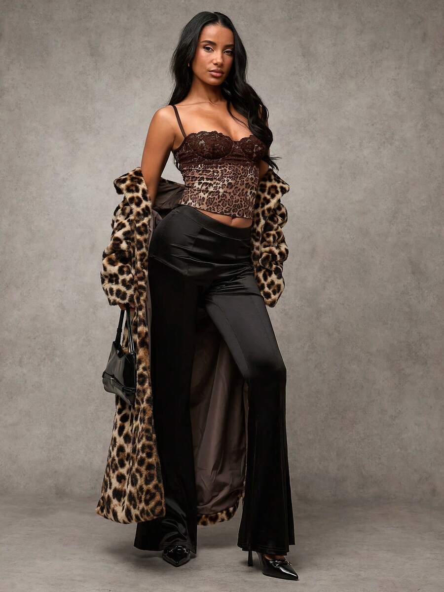 Women's black contrast lace camisole with spaghetti straps, cup detail, semi-sheer finish, and slim fit for going out or date night.