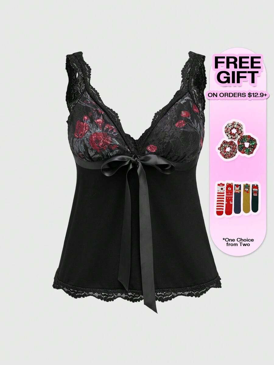 Women's black crop camisole top with rose pattern contrast lace, deep V-neck, and wide shoulder straps.