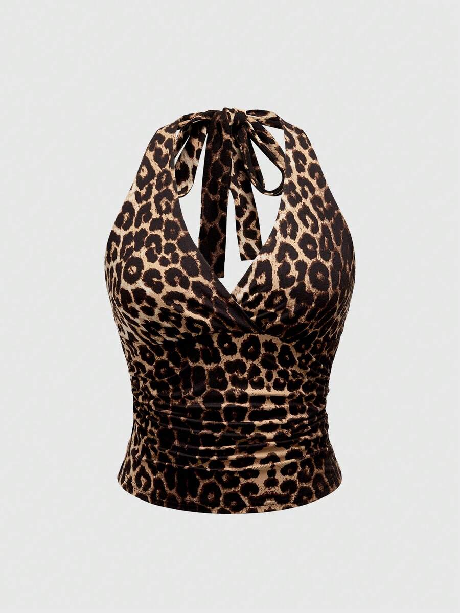 Women's halter crop tank top featuring a backless silhouette and ruched detailing in a slim fit design.