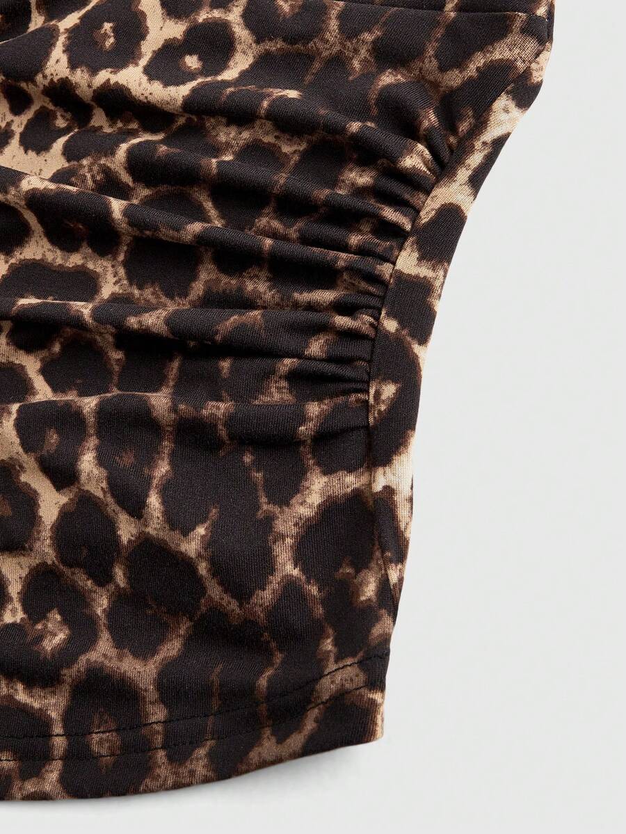Women's halter crop tank top featuring a backless silhouette and ruched detailing in a slim fit design.