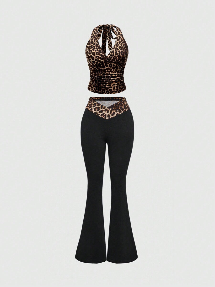 Women's halter crop tank top featuring a backless silhouette and ruched detailing in a slim fit design.