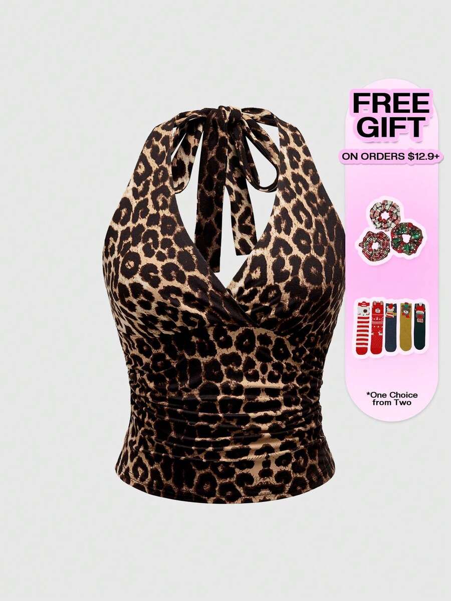 Women's halter crop tank top featuring a backless silhouette and ruched detailing in a slim fit design.